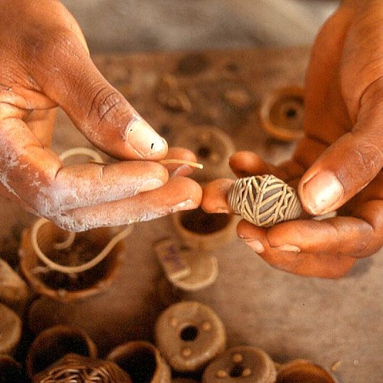 making recycled brass beads, Ghana