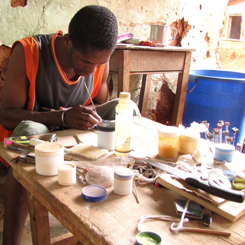 Handpainting recycled glass beads near Koforidua, Ghana