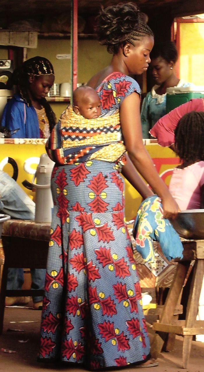 Wearing African wax print fabric in Africa