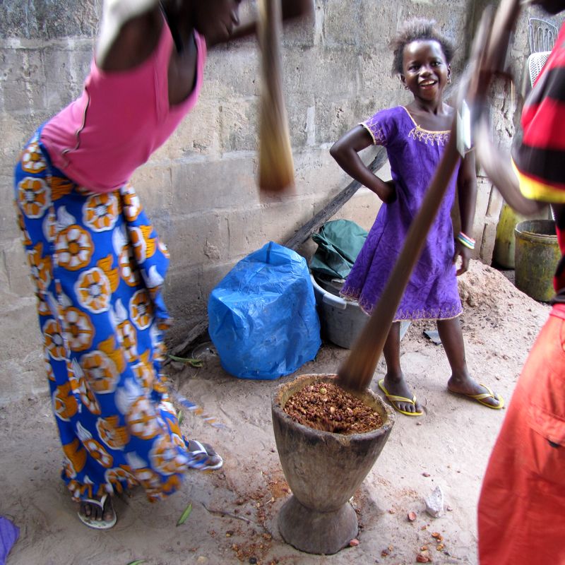 Pounding kola nut in The Gambia