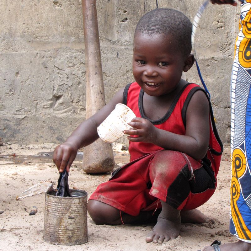 Children dyeing with indigo in Musa's compound